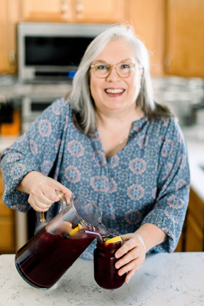 Glenda pouring blueberry lemonade.